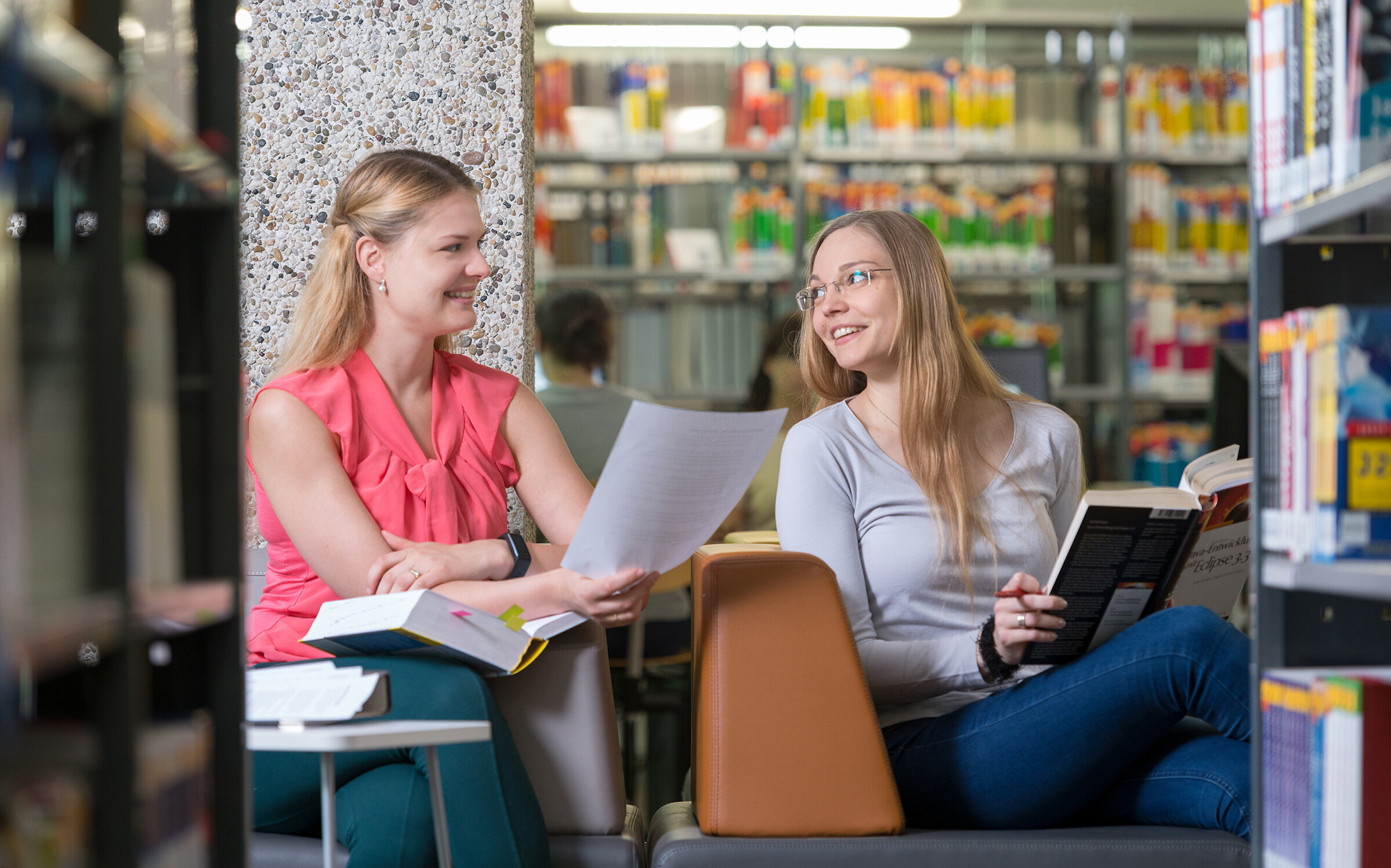 two students reading in the library two students reading in the library