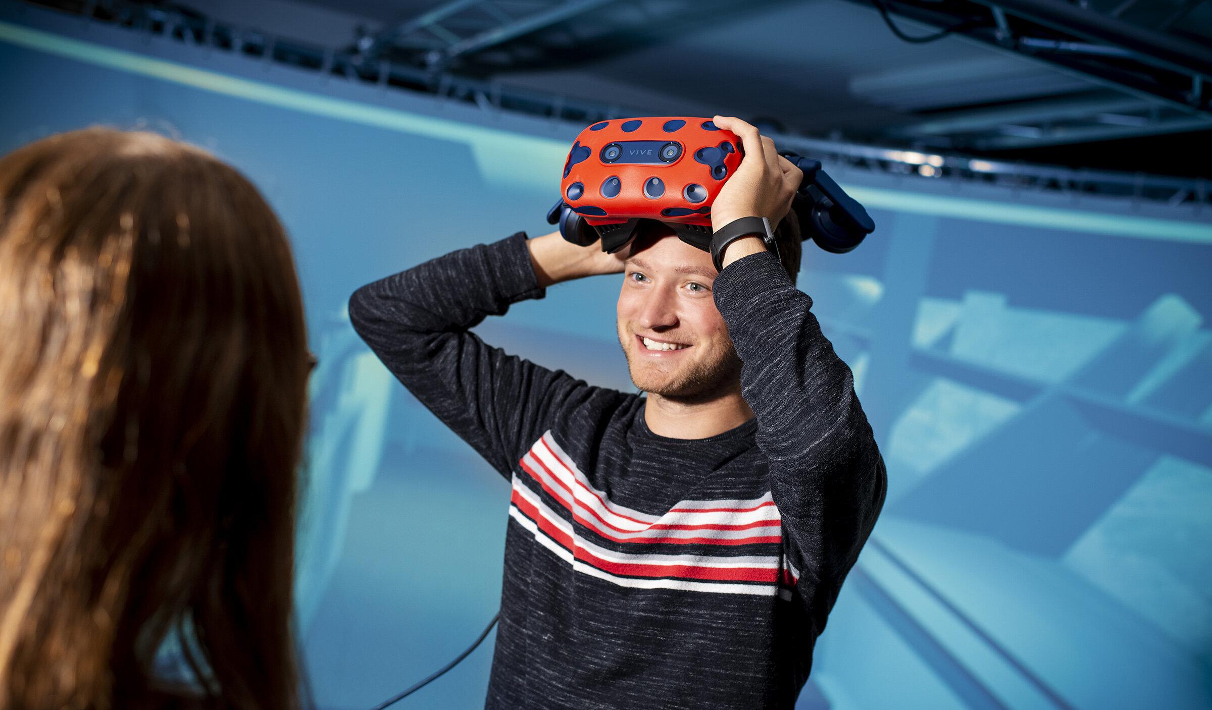 student putting on VR goggles student putting on VR goggles
