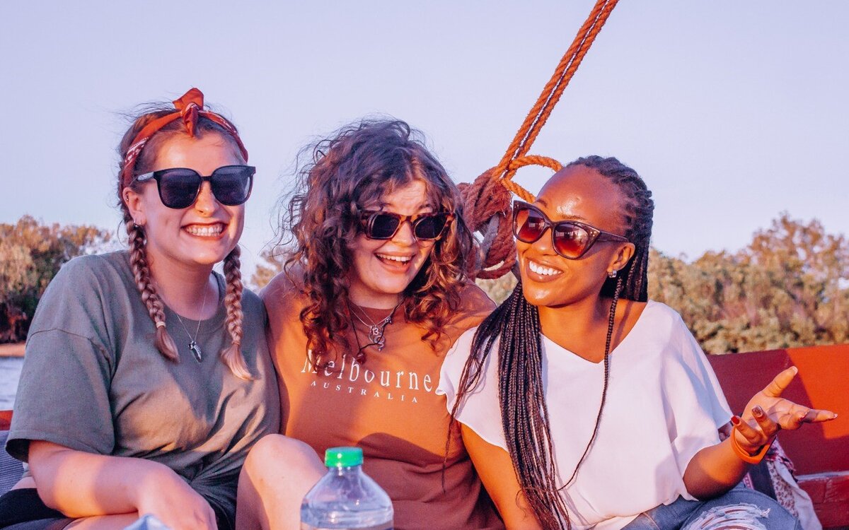 women from different countries doing a boat trip