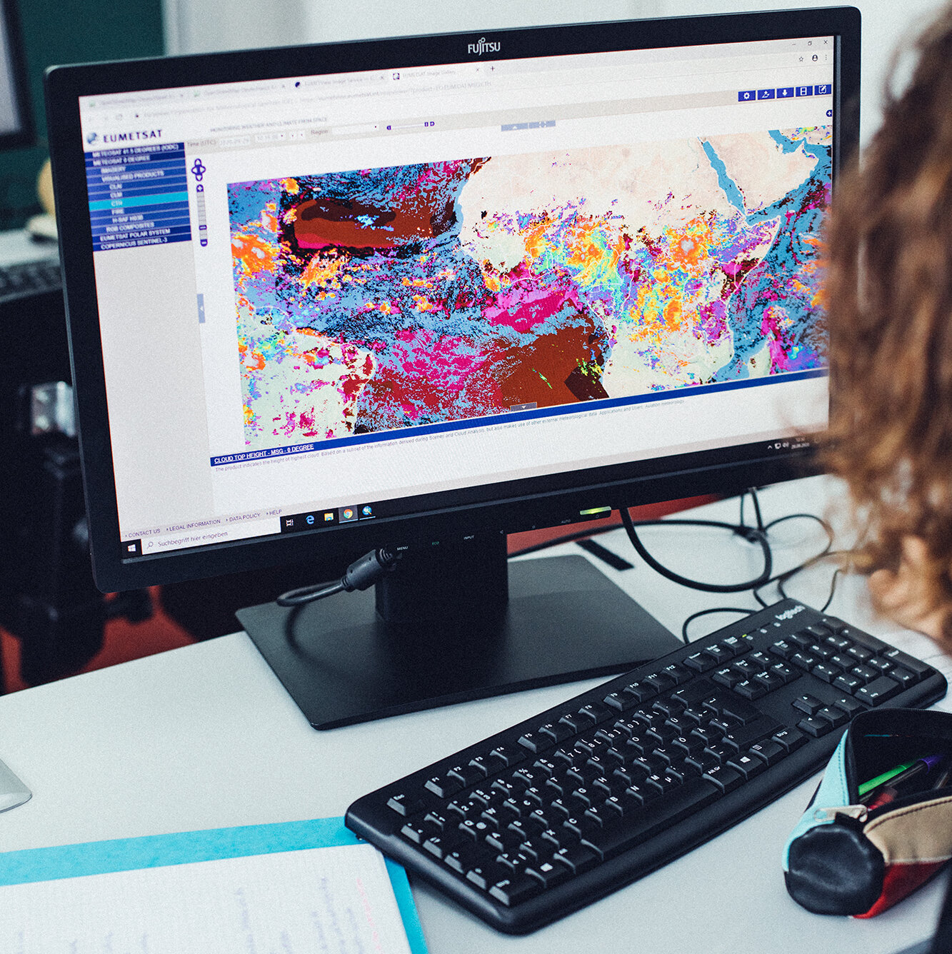 computer screen with colourful map on it computer screen with colourful map on it