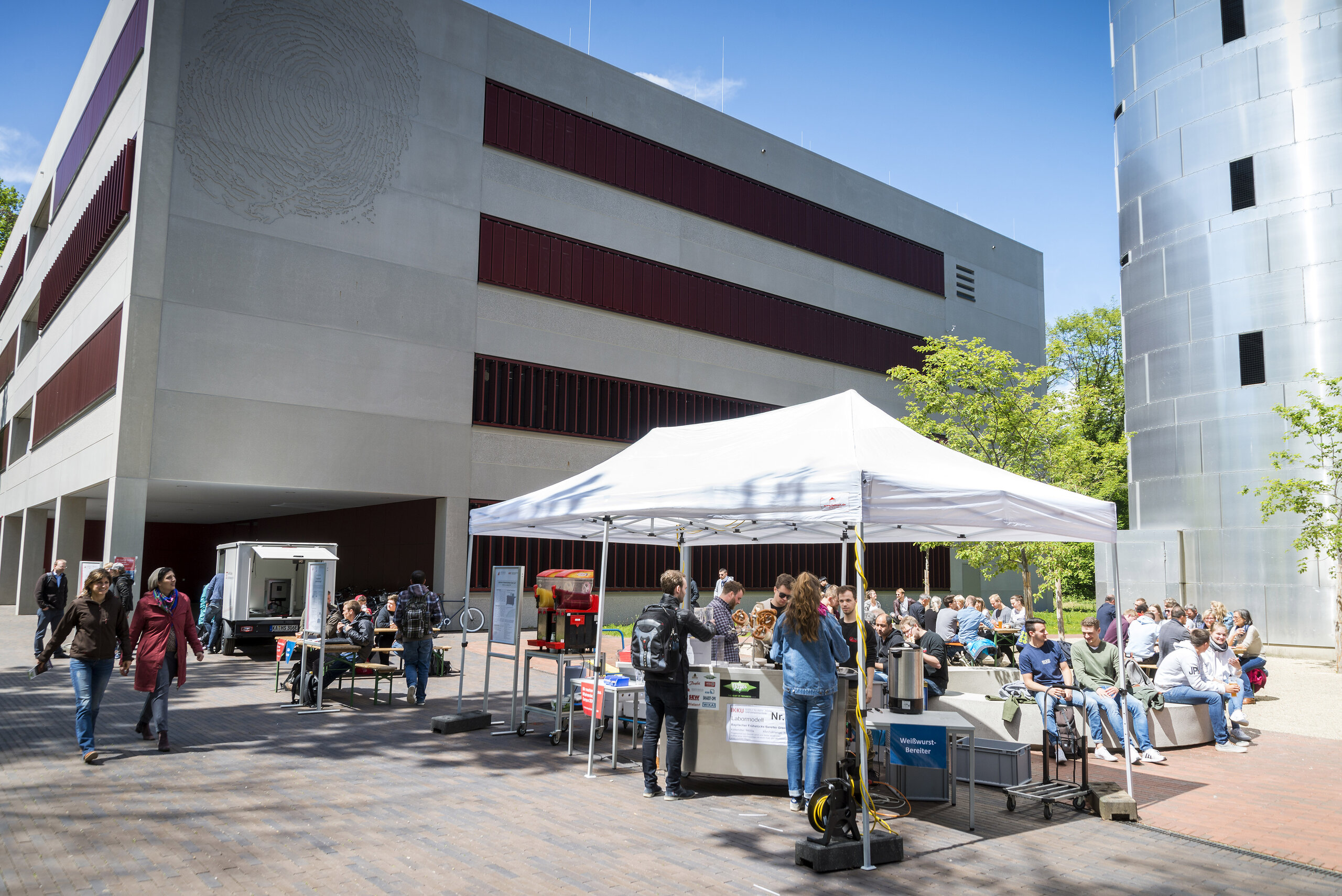 event with students, umbrellas, food stations taking place in front of the N building event with students, umbrellas, food stations taking place in front of the N building