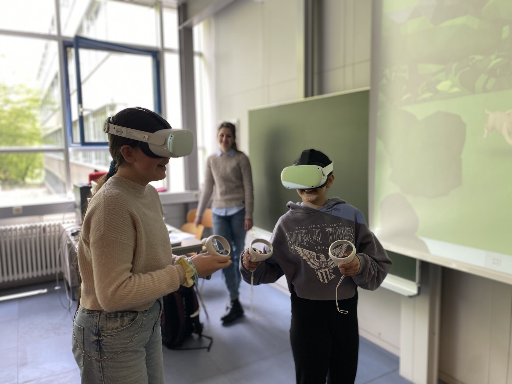 Two Girls' Day participants try out their learning worlds in VR.