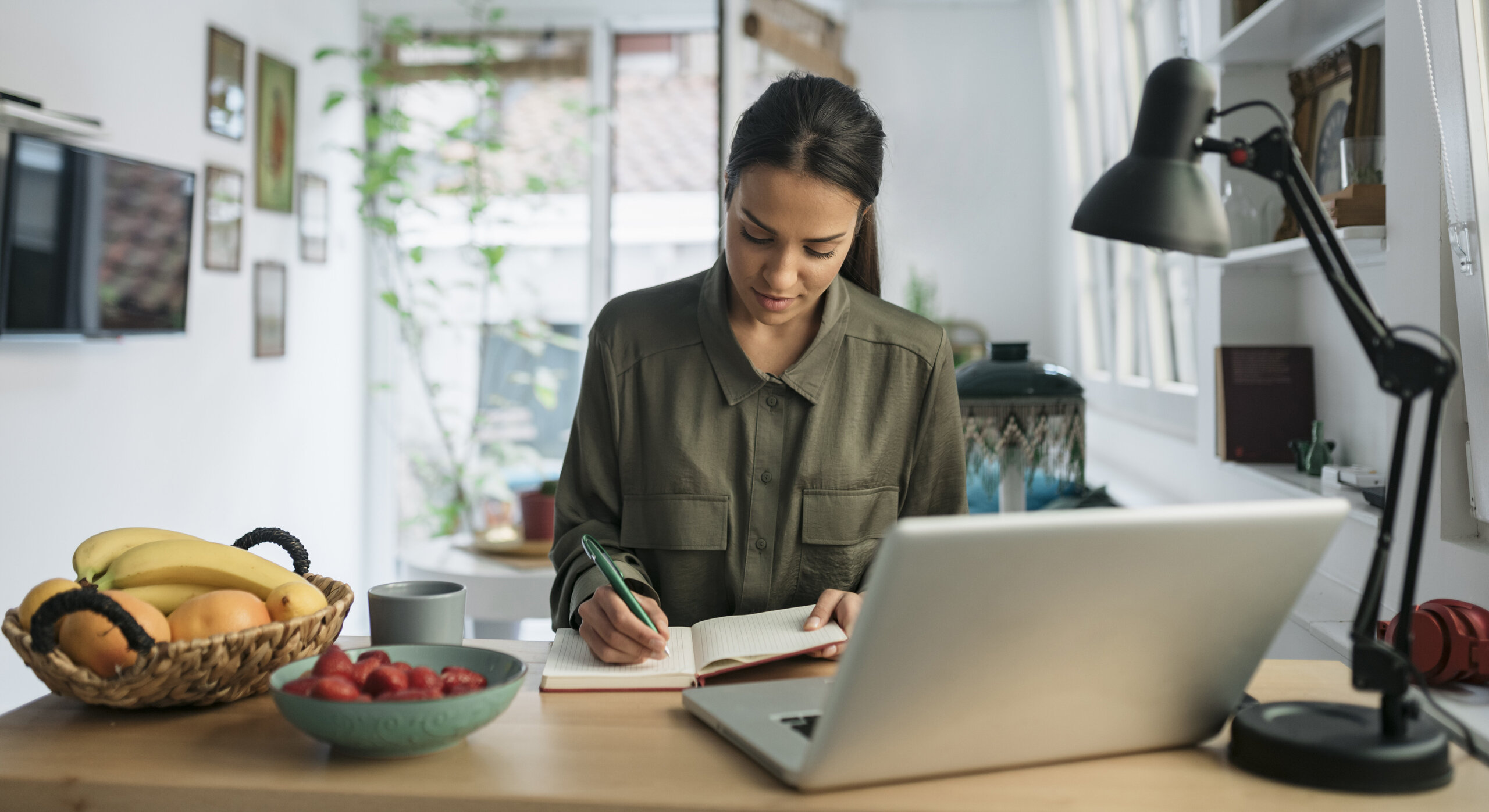 Student at home, working at laptop Student at home, working at laptop