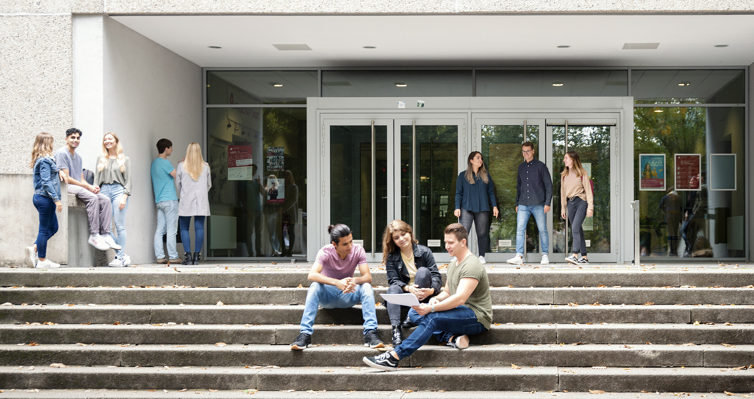 Groups of students in front of building at HKA campus Groups of students in front of building at HKA campus