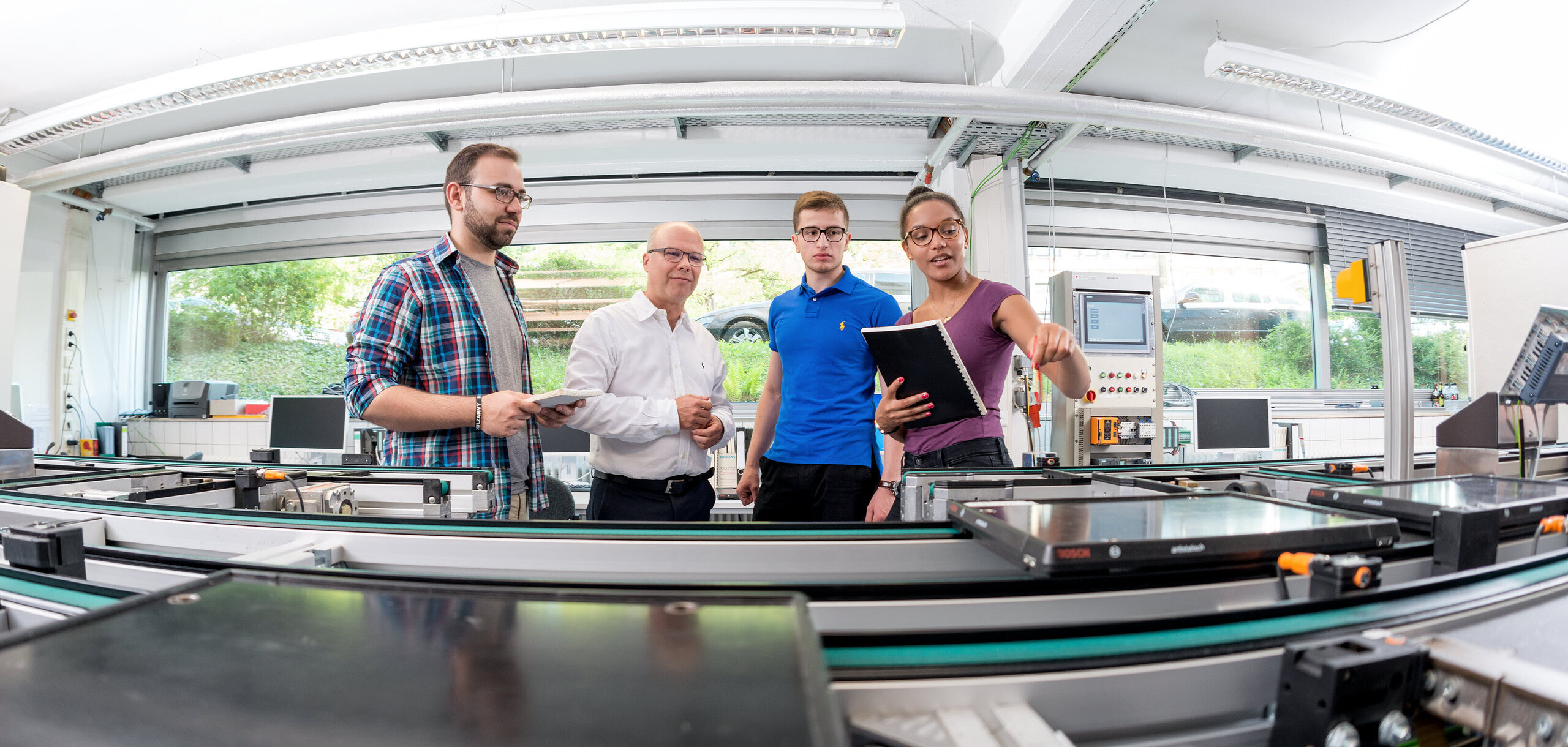 Welcome to the Institute of Applied Research at HKA! Students around Prof. Dr. Ing. Christian Wurll in the laboratory Welcome to the Institute of Applied Research at HKA! Students around Prof. Dr. Ing. Christian Wurll in the laboratory